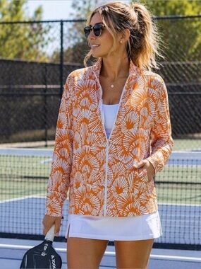 NWT Tommy Bahama Golf orange and white seashell jacket, UPF 50, women’s large.